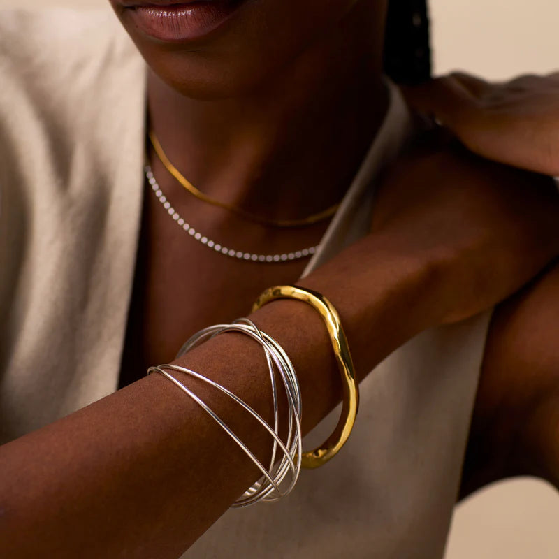 Orelia Polished Hammered Bangle in Gold Orelia